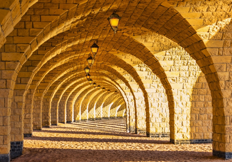 Vlies Fototapete 66 - Arched Stone Colonnades Architektur Tapete 3D Perspektive Gewölbe